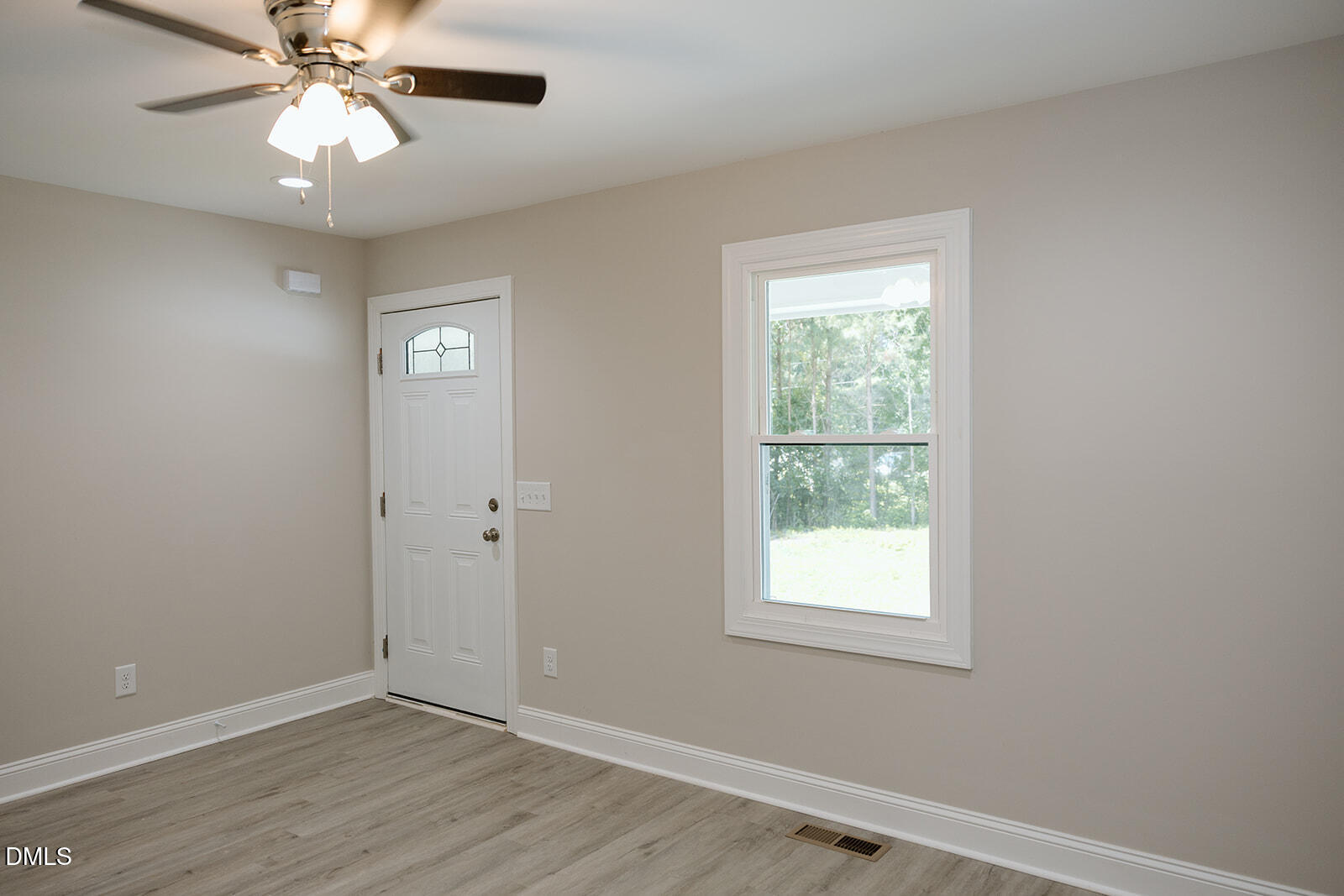 291 Knight Road Broadway, NC 27505 - Photo 2 of 18 a view of an empty room with window and chandelier fan