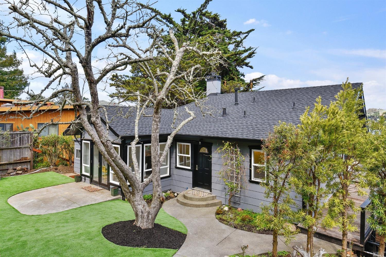 a front view of a house with garden