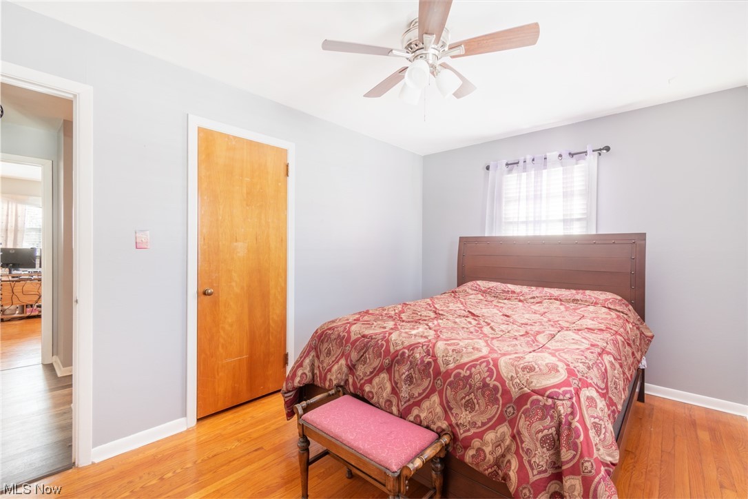 2926 Brunswick Road Youngstown, OH 44511 - Photo 25 of 33 Bedroom featuring hardwood floors, ceiling fan, and closet