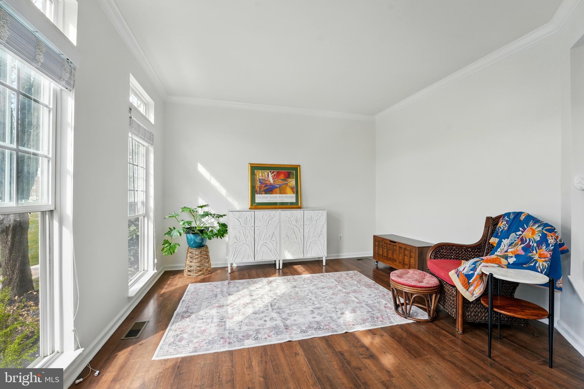 6712 Eldermill Lane Gainesville, VA 20155 - Photo 10 of 56 a living room with furniture and a wooden floor