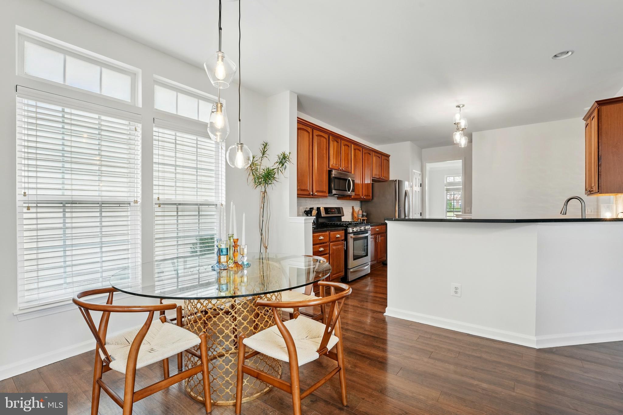 6712 Eldermill Lane Gainesville, VA 20155 - Photo 12 of 56 a view of a dining room with furniture and a window