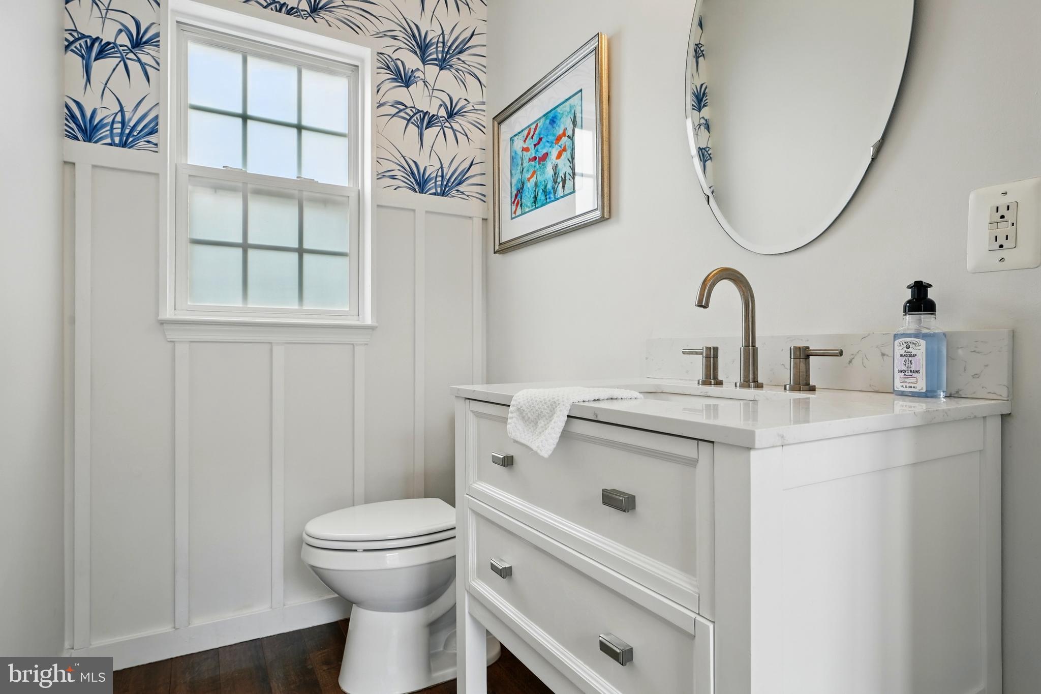 6712 Eldermill Lane Gainesville, VA 20155 - Photo 14 of 56 a bathroom with a toilet sink and mirror