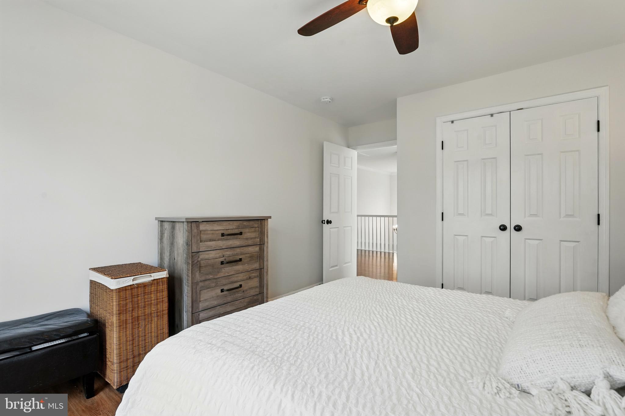 6712 Eldermill Lane Gainesville, VA 20155 - Photo 27 of 56 a bedroom with a bed and cabinets