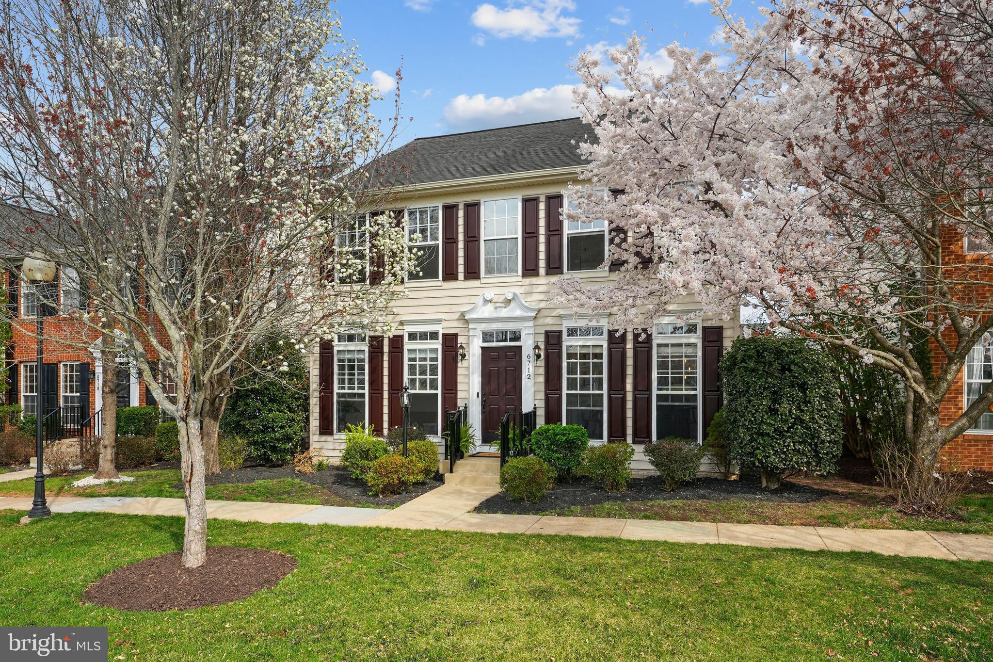6712 Eldermill Lane Gainesville, VA 20155 - Photo 3 of 56 a front view of a house with a yard