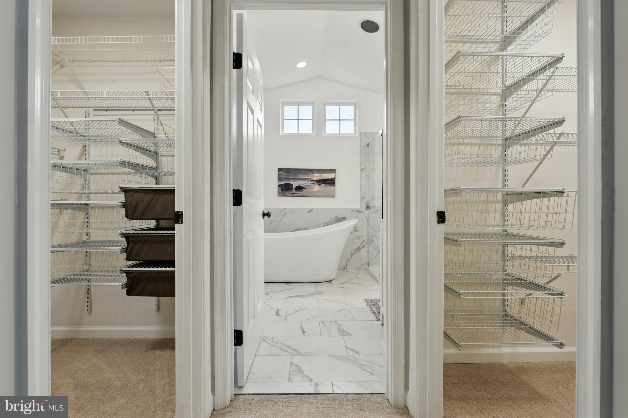 6712 Eldermill Lane Gainesville, VA 20155 - Photo 31 of 56 a bathroom with a glass shower door