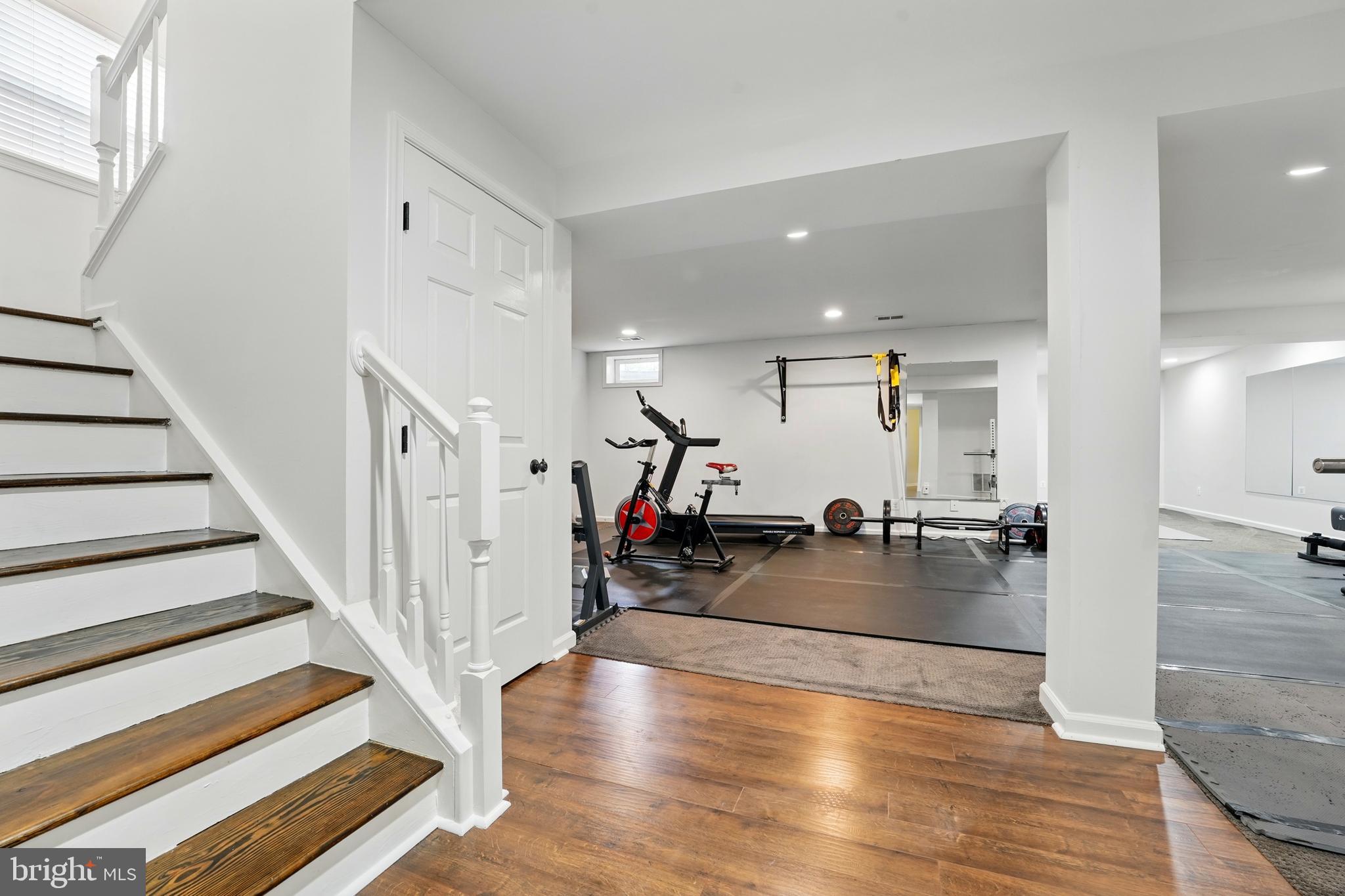 6712 Eldermill Lane Gainesville, VA 20155 - Photo 36 of 56 a view of a entryway livingroom and hallway with wooden floor