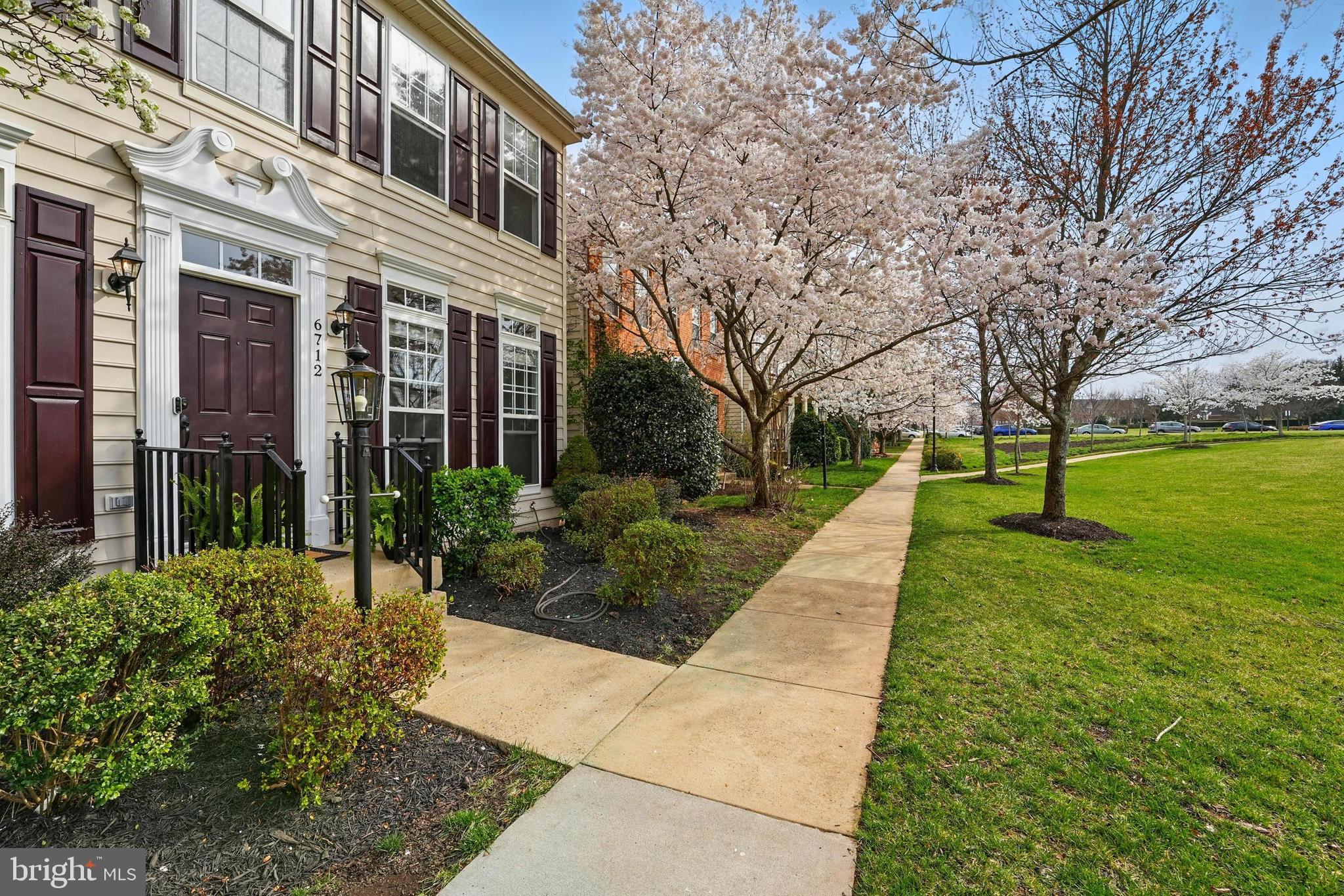 6712 Eldermill Lane Gainesville, VA 20155 - Photo 4 of 56 a view of a building with garden and trees