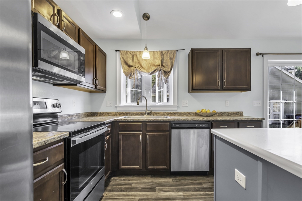 1 Lois Lane Townsend, MA 01469 - Photo 12 of 38 a kitchen with stainless steel appliances granite countertop a sink and a stove