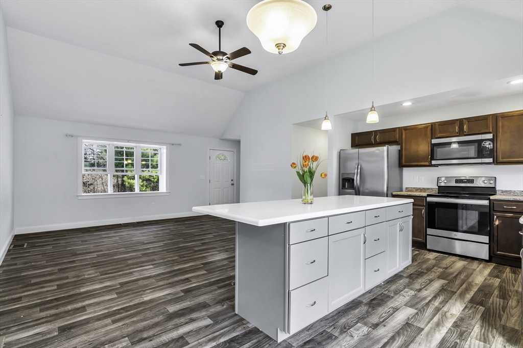 1 Lois Lane Townsend, MA 01469 - Photo 15 of 38 a kitchen with stainless steel appliances a stove top oven and sink