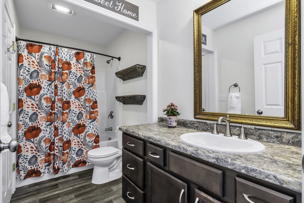 1 Lois Lane Townsend, MA 01469 - Photo 17 of 38 a bathroom with a granite countertop sink and a mirror