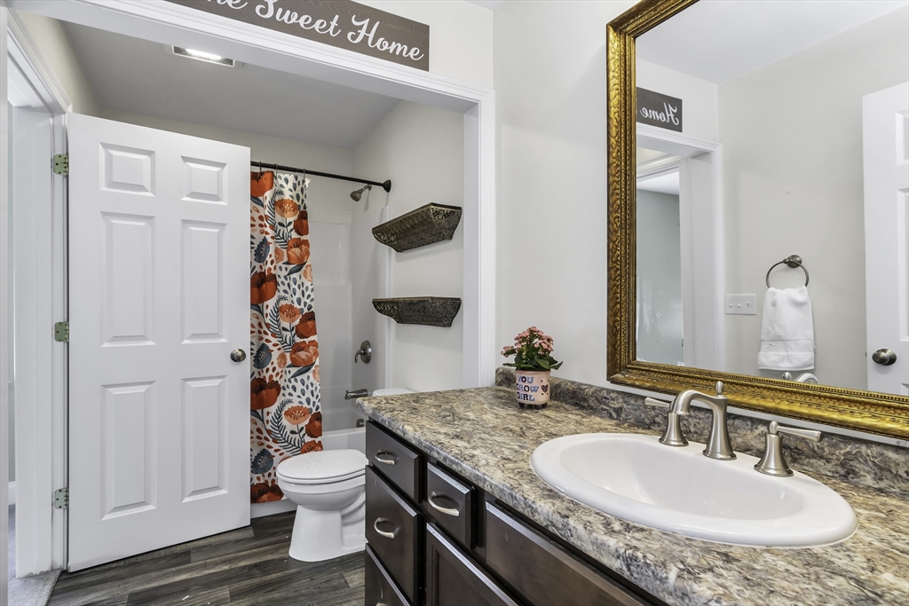 1 Lois Lane Townsend, MA 01469 - Photo 21 of 38 a bathroom with a granite countertop sink and a mirror