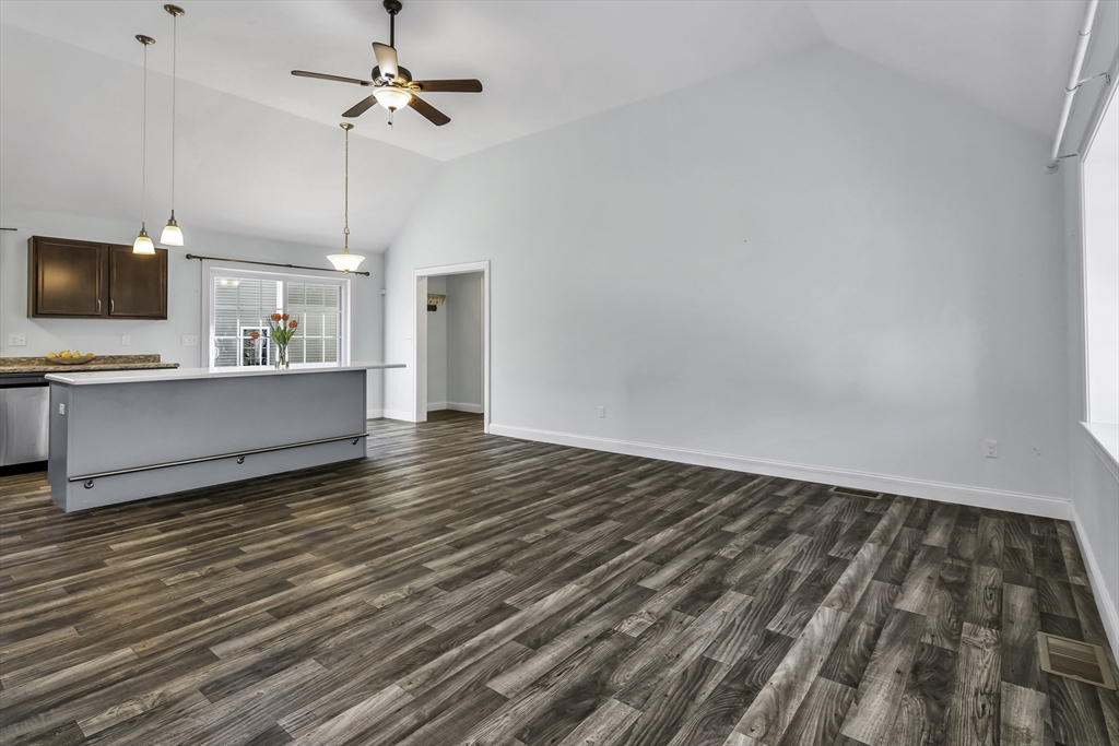 1 Lois Lane Townsend, MA 01469 - Photo 6 of 38 a view of a room with wooden floor and a ceiling fan