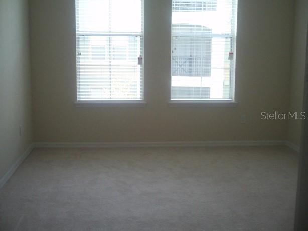 8168 Boat Hook Loop, Unit 202 Windermere, FL 34786 - Photo 3 of 5 a view of an empty room with a window