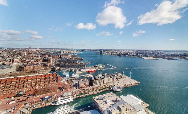 an aerial view of a house with outdoor space