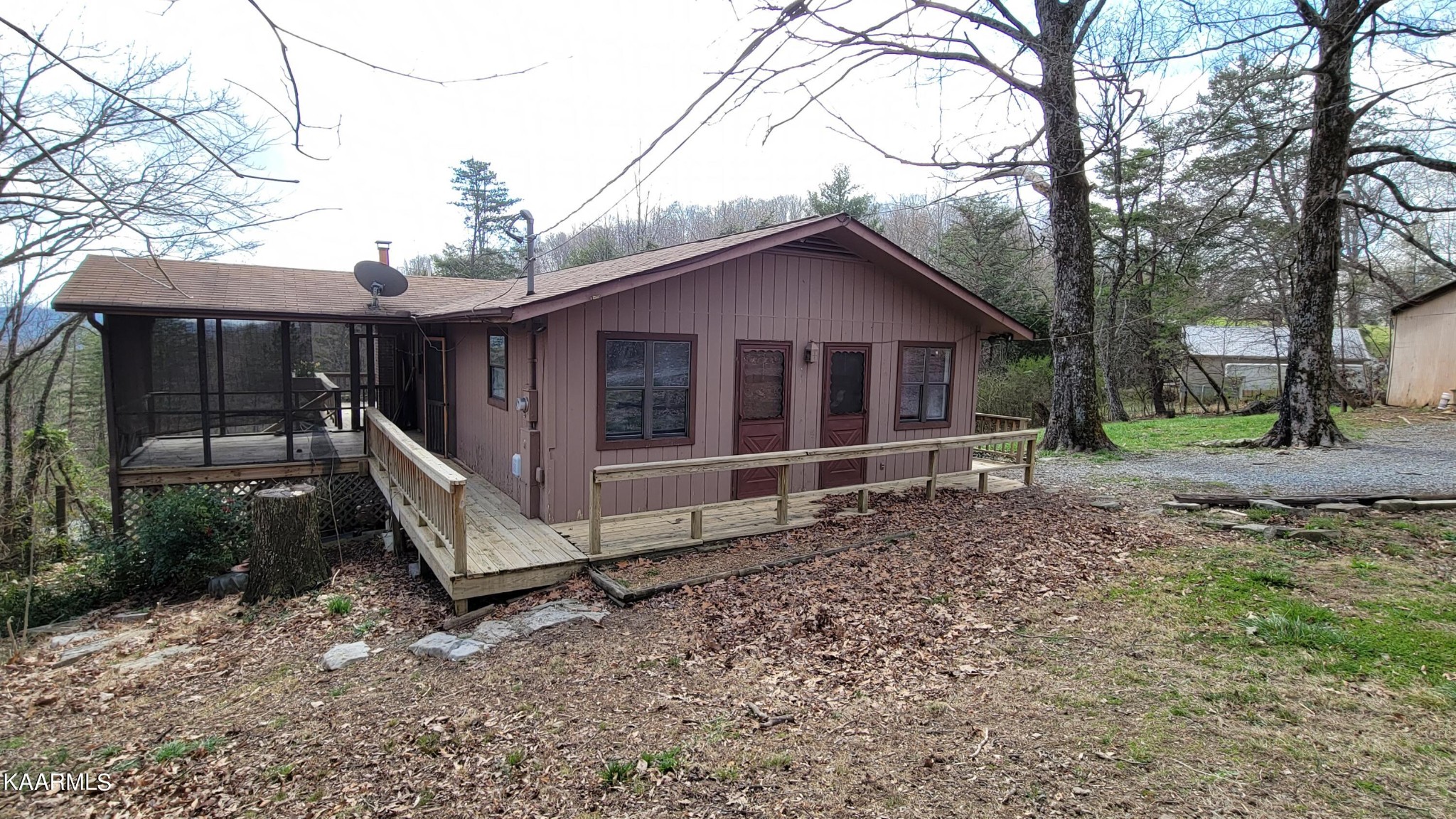 959 Fox Hunter Road Maynardville, TN 37807 - Photo 17 of 17 a view of house with a big yard and large tree