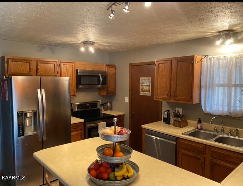 959 Fox Hunter Road Maynardville, TN 37807 - Photo 3 of 17 a kitchen with stainless steel appliances granite countertop a sink a stove and a refrigerator