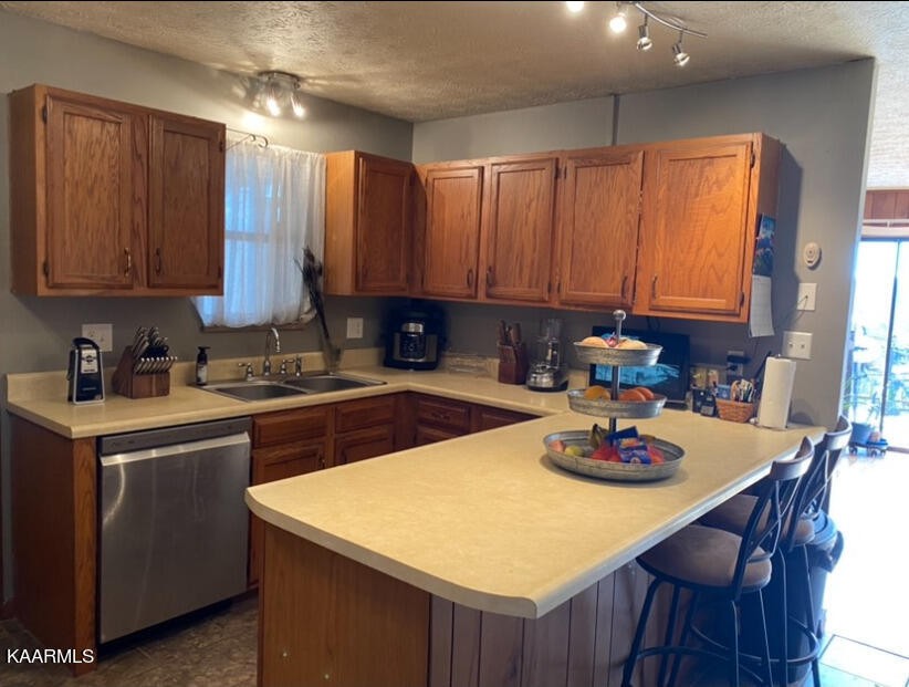 959 Fox Hunter Road Maynardville, TN 37807 - Photo 4 of 17 a kitchen with a stove a sink dishwasher and cabinets with wooden floor