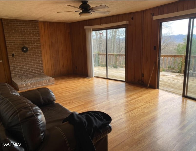 959 Fox Hunter Road Maynardville, TN 37807 - Photo 7 of 17 a living room with a bed and a floor to ceiling window