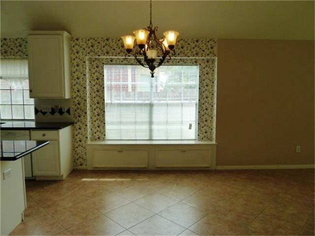 4542 Springfield Lakes Street Sugar Land, TX 77479 - Photo 7 of 16 Formal dining area with chandelier and plenty of room for entertaining.