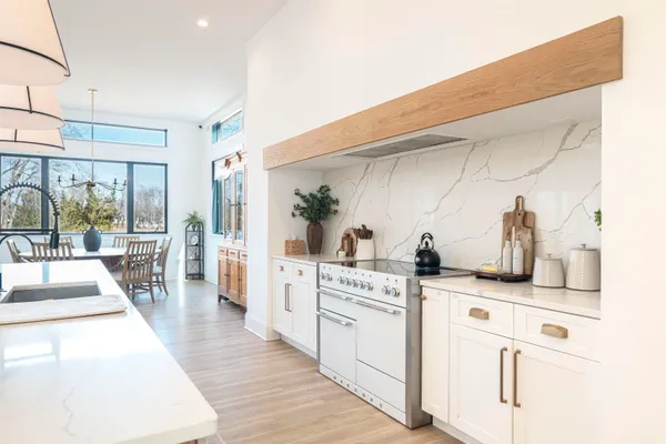 a kitchen with granite countertop a sink and cabinets
