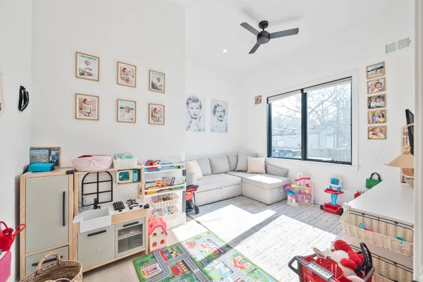 a bedroom with furniture and a window