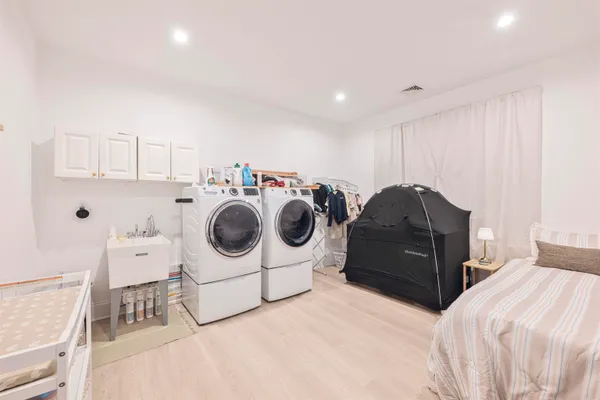 a bedroom with a bed and cabinets