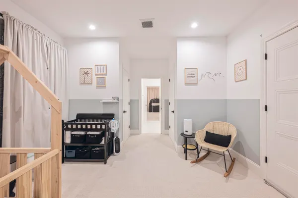 a living room with furniture and a piano