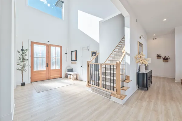 a view of entryway with wooden floor and windows