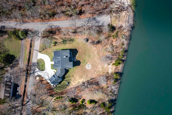 a aerial view of a house with a yard