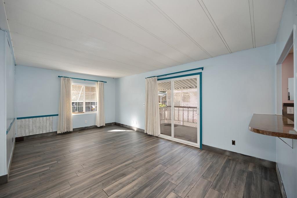 2874 Hidden Springs Circle Placerville, CA 95667 - Photo 15 of 41 a view of an empty room with wooden floor and a window