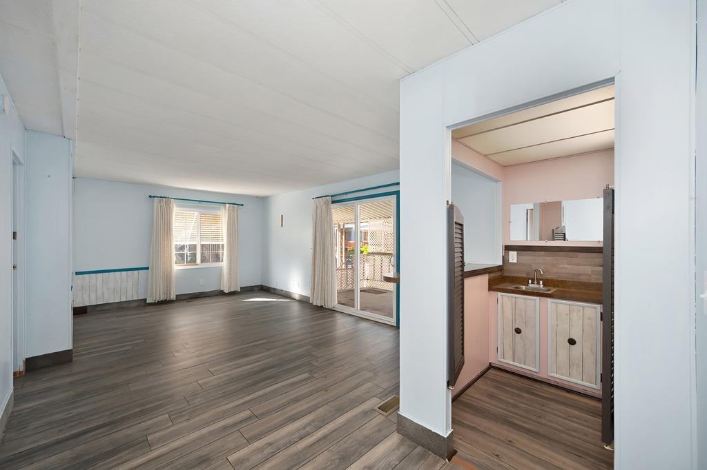 2874 Hidden Springs Circle Placerville, CA 95667 - Photo 17 of 41 an empty room with wooden floor and windows