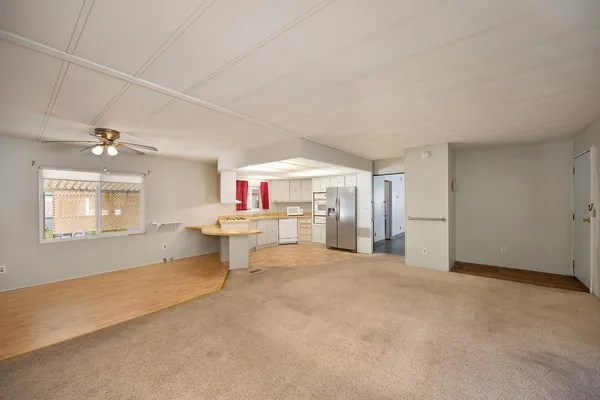 a kitchen with cabinets appliances and a sink