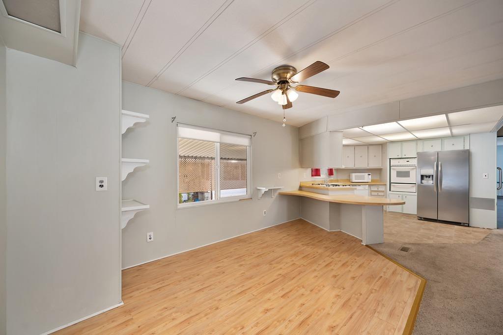 2874 Hidden Springs Circle Placerville, CA 95667 - Photo 28 of 41 a open kitchen with kitchen island a sink stainless steel appliances and window