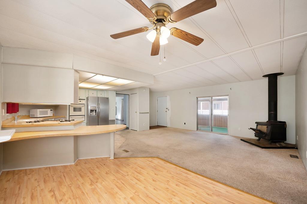 2874 Hidden Springs Circle Placerville, CA 95667 - Photo 29 of 41 a view of a kitchen with a sink and a chandelier fan
