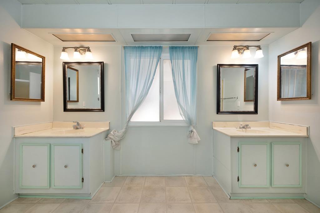 2874 Hidden Springs Circle Placerville, CA 95667 - Photo 32 of 41 a bathroom with a sink and a mirror