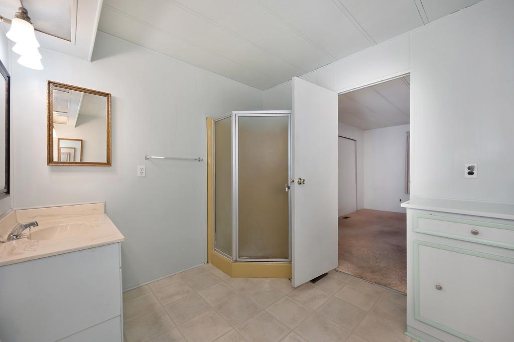 2874 Hidden Springs Circle Placerville, CA 95667 - Photo 34 of 41 a view of a bathroom with sink and mirror