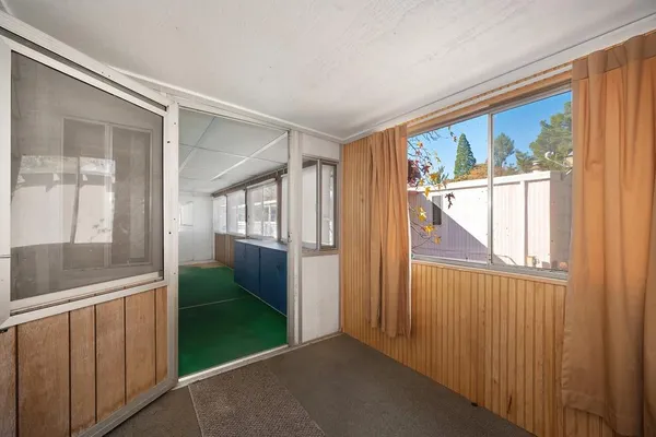 a view of a balcony and trees