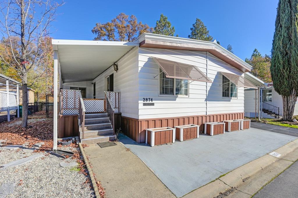 2874 Hidden Springs Circle Placerville, CA 95667 - Photo 9 of 41 a front view of a house with a balcony