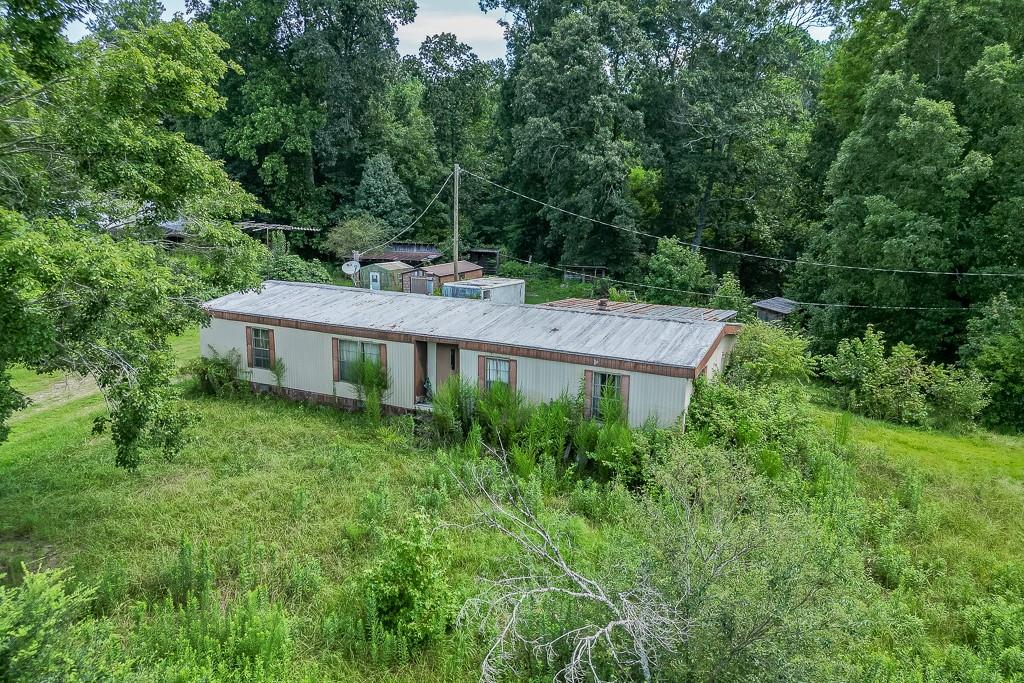 3340 Chamblee Gap Road Cumming, GA 30040 - Photo 14 of 15 a view of a house with a backyard and garden