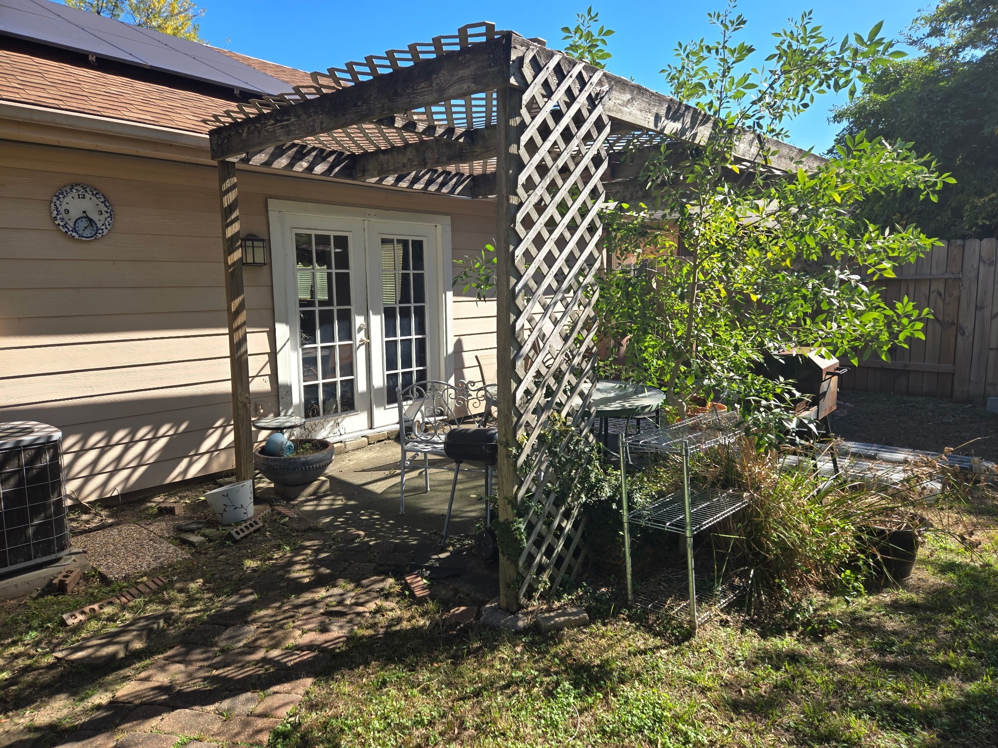 11615 Stone Bridge Drive Houston, TX 77064 - Photo 7 of 14 a backyard of a house with table and chairs