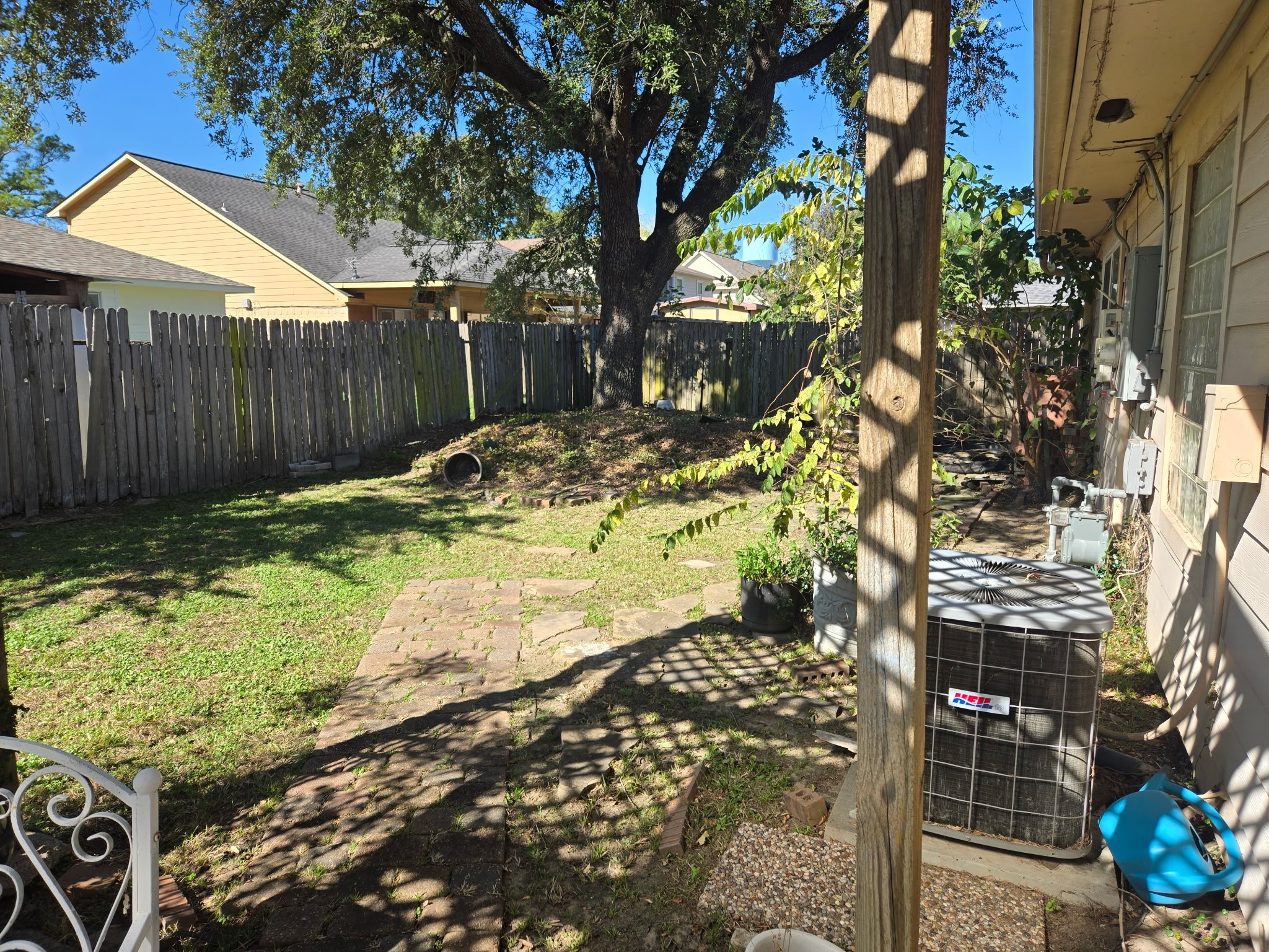 11615 Stone Bridge Drive Houston, TX 77064 - Photo 8 of 14 a view of a backyard with wooden fence and a bench