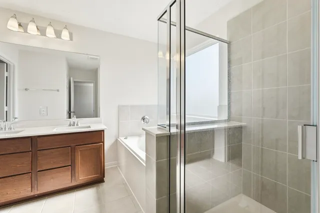 a bathroom with a double vanity sink and mirror