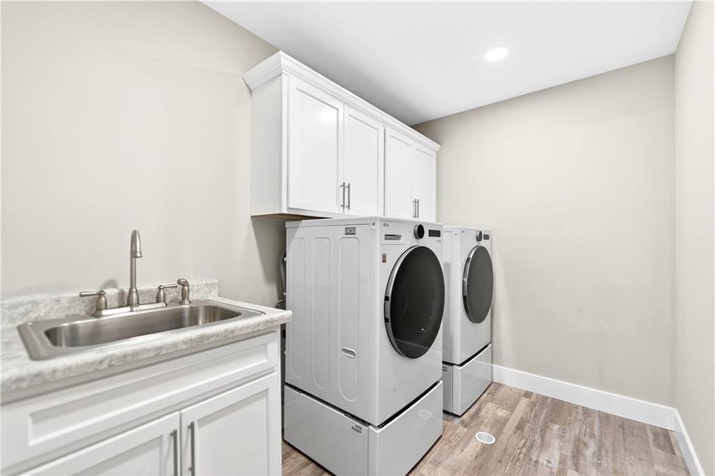 734 Sandstone Way Rostraver Township, PA 15012 - Photo 22 of 50 The laundry room is conveniently located on the main floor. The 2 year old washer and dryer are included.