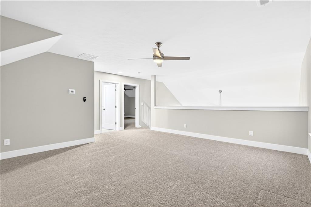 734 Sandstone Way Rostraver Township, PA 15012 - Photo 36 of 50 There's so many uses for this upper area room! Will it be a third bedroom, an exercise area or your office space?