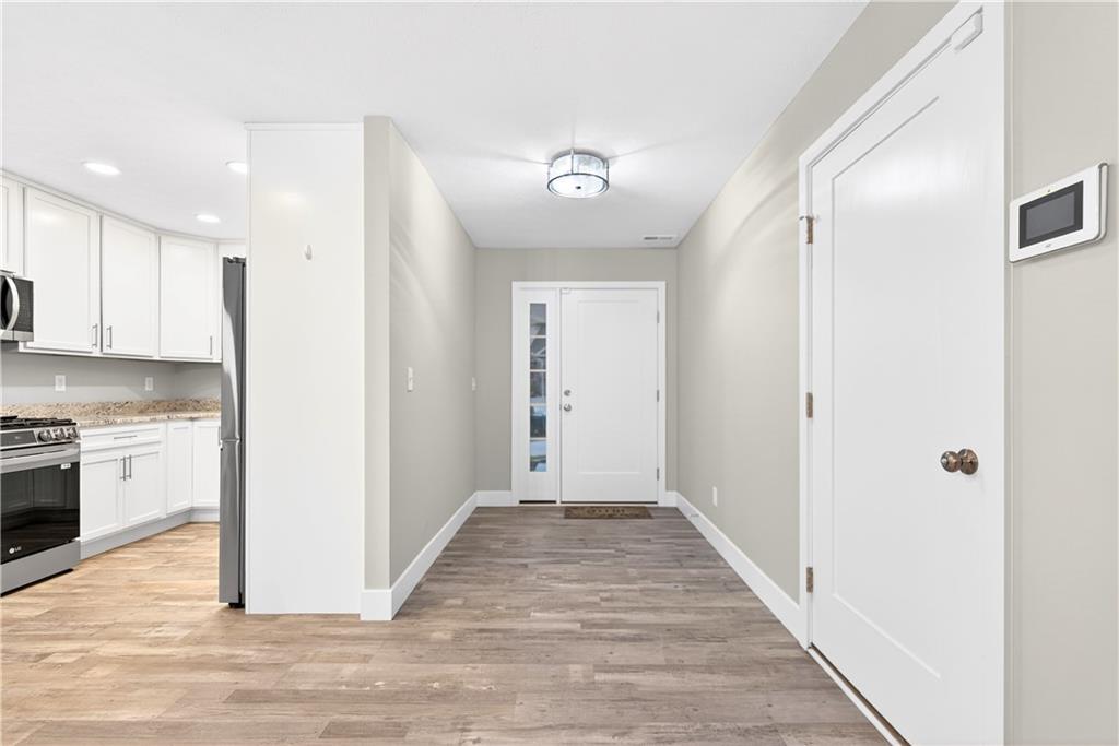 734 Sandstone Way Rostraver Township, PA 15012 - Photo 4 of 50 When you come in the front entry you will instantly notice the Cali Vinyl Pro "Gray Ash" vinyl plank floors that are throughout the main floor.