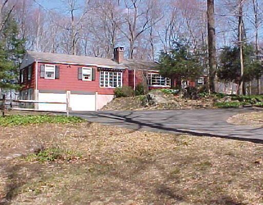 62 New Road Ridgefield, CT 06877 - Photo 1 of 1 a view of a brick house with a yard