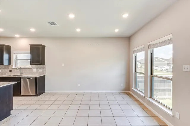 a view of kitchen with windows