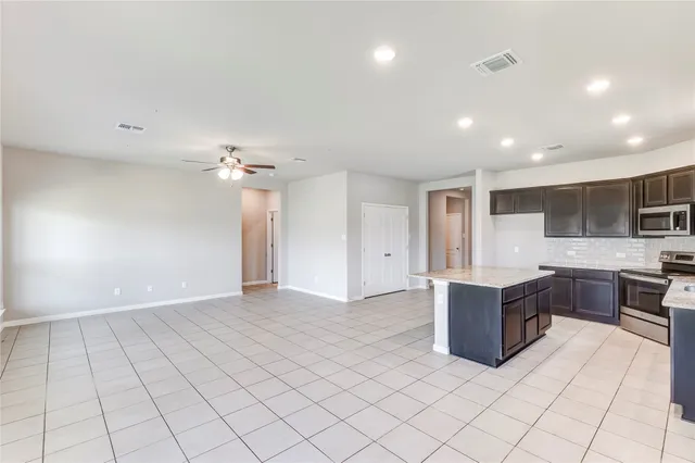 a view of kitchen and windows