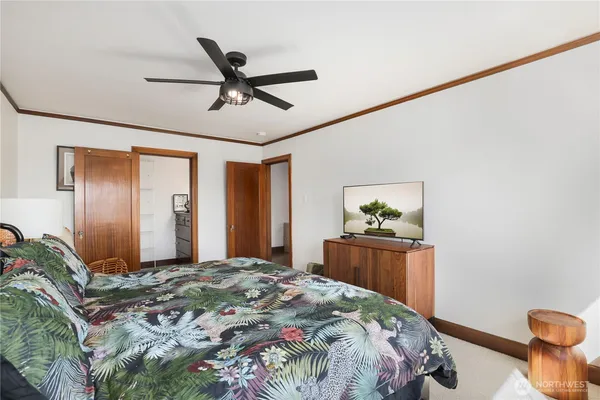 a bedroom with a bed and a dresser
