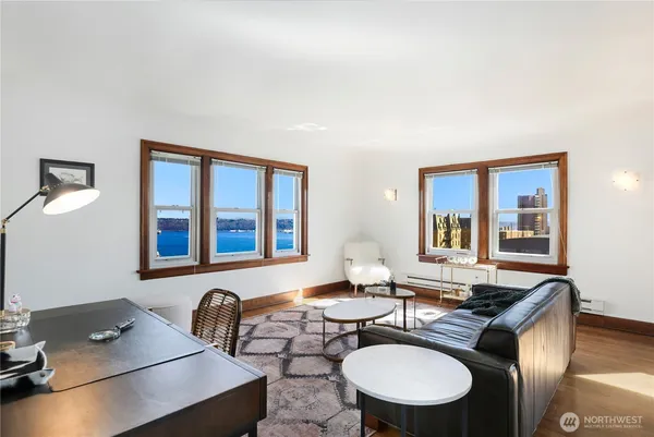 a living room with furniture and a large window